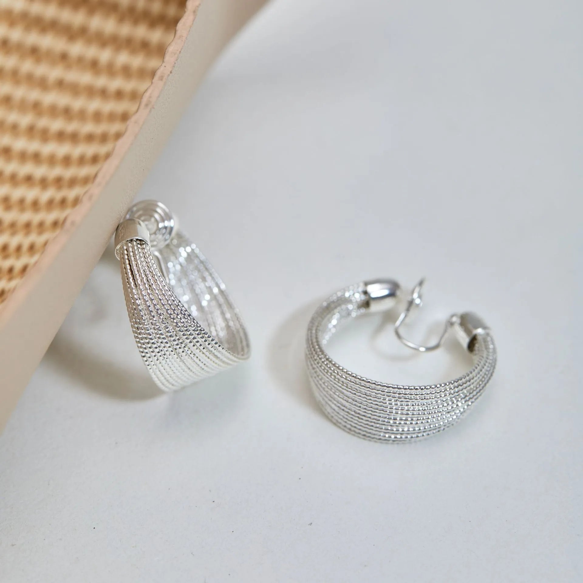 Copper geometric multi-layer bracelet earrings in silver or gold finish, available as clip-on or stud styles