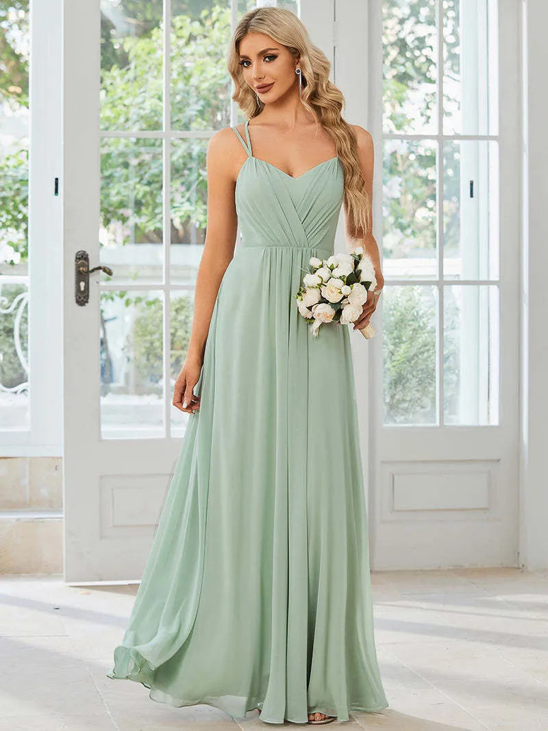 Women's light green sleeveless A-line banquet dress with long pleated skirt on a hanger.