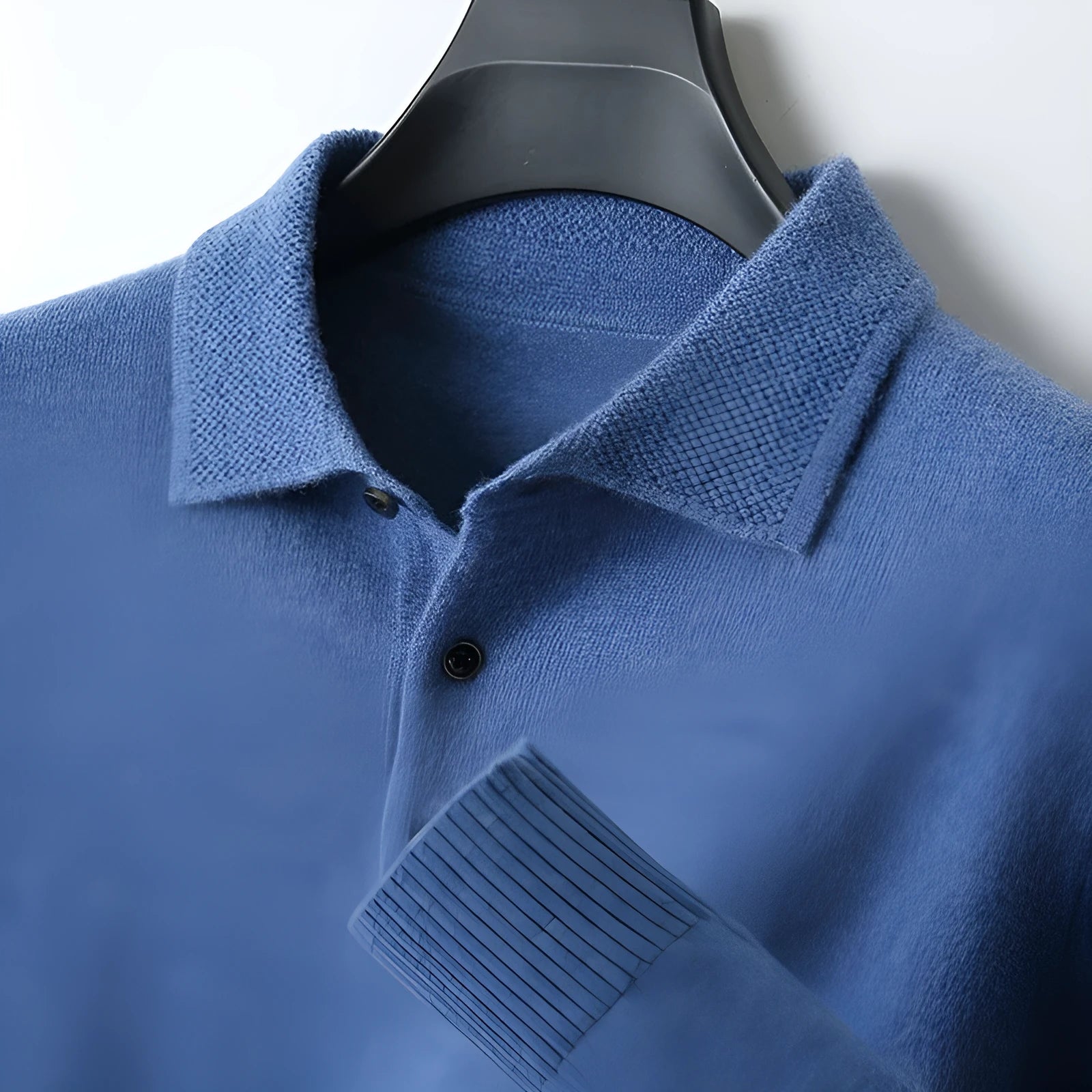 Men's woolen polo collar pullover sweater in noble blue colour on a hanger.