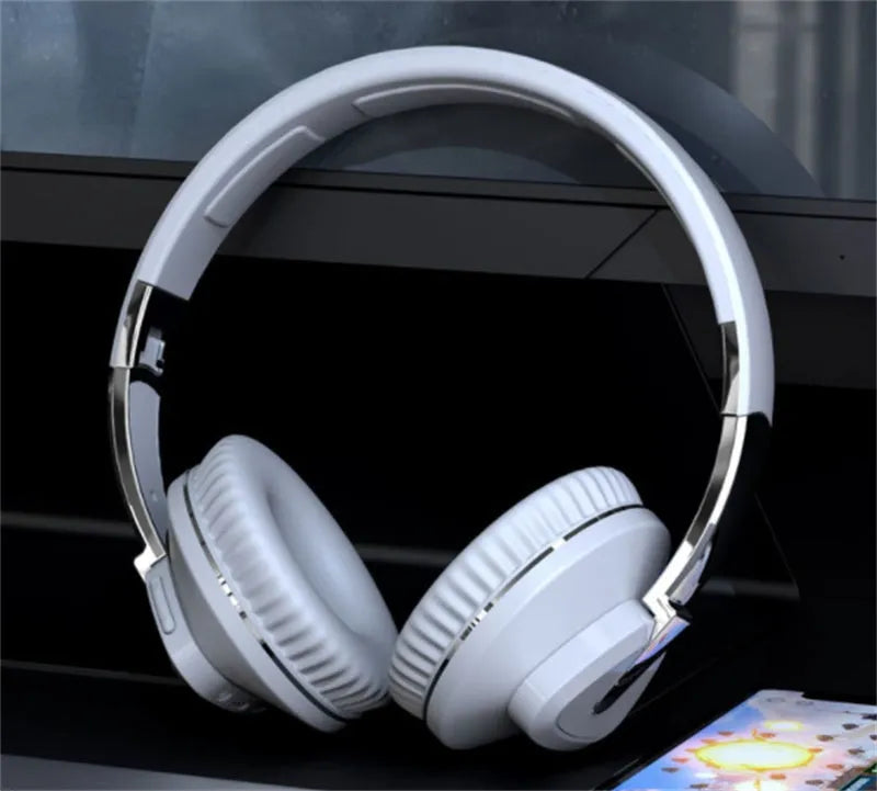 H3 Wireless Bluetooth over-ear headset with all-inclusive ear cups in black, shown with AUX cable.