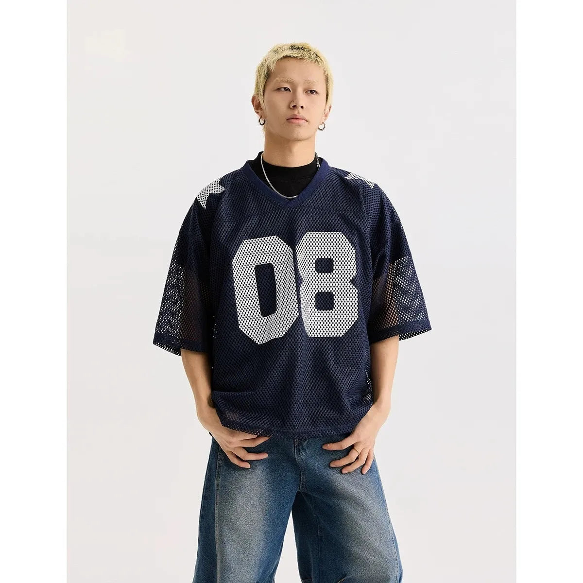 Black and navy blue half sleeve pullover shirt with loose fit and letter pattern detail