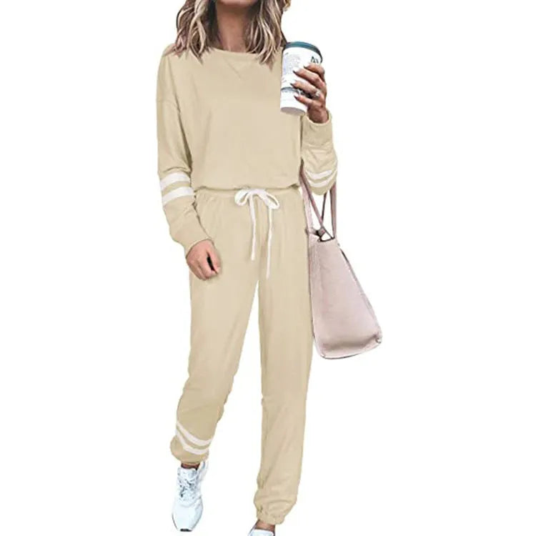 Women's loose-fitting casual suit set in a solid colour, comprising a long-sleeve top and matching trousers.