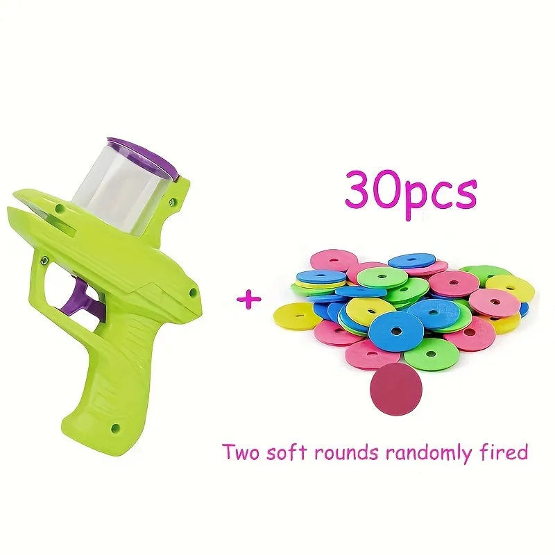 Green or purple plastic cat toy launcher with soft foam discs for interactive play.