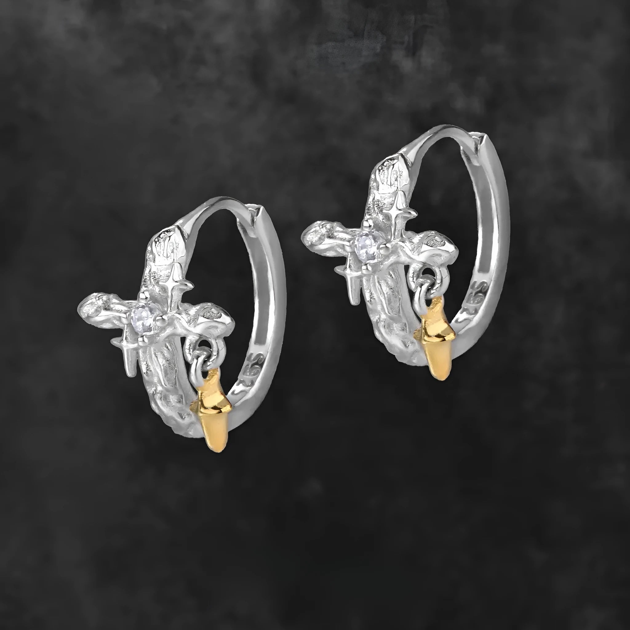 XINGX geometric cross earrings in 925 silver with white gold electroplated finish and circular detail.
