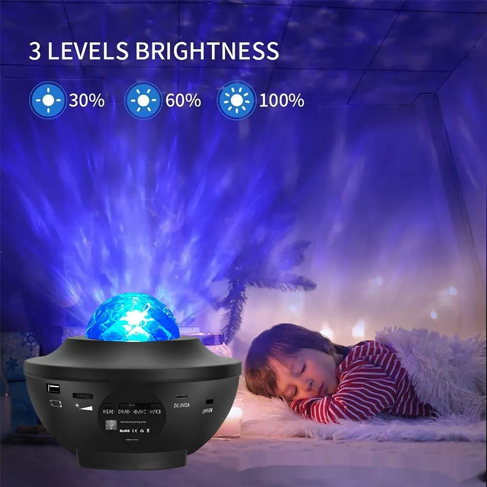 Black bowl-shaped star projection lamp with laser effects and Bluetooth connectivity on wooden desk