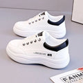 Women's white Korean-style lace-up pumps with cross straps and a flat rubber sole.