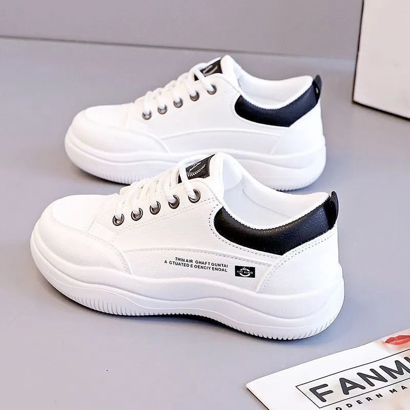 Women's white Korean-style lace-up pumps with cross straps and a flat rubber sole.