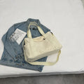 Women's polyester shoulder bag in solid colour with external pocket and internal phone compartment