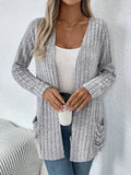 Long sleeve loose fit cardigan in solid colour with pockets, shown in black and granny grey.