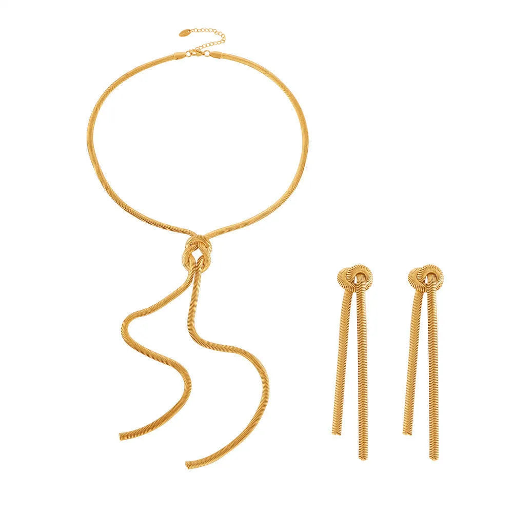 Gold colour knotted tassel pendant on a snake chain necklace with matching electroplated earrings.