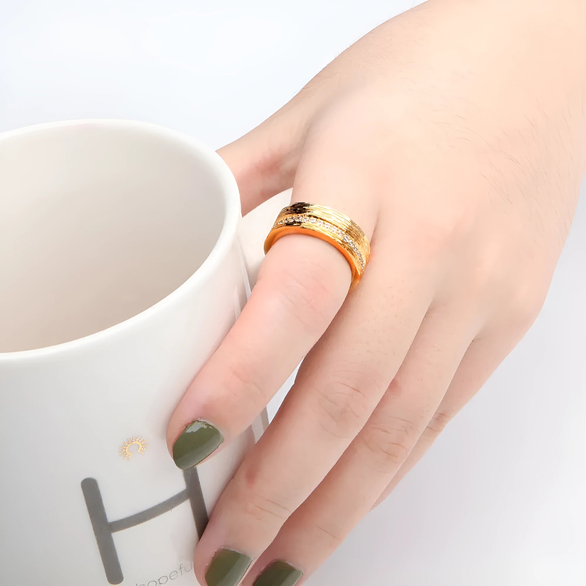 Gold geometric zircon ring with angular design on copper construction