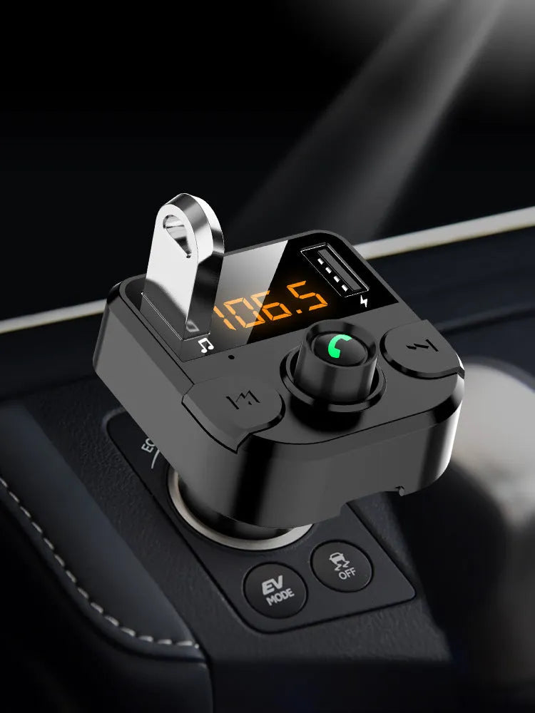 Black car Bluetooth FM transmitter plugged into vehicle cigarette lighter socket