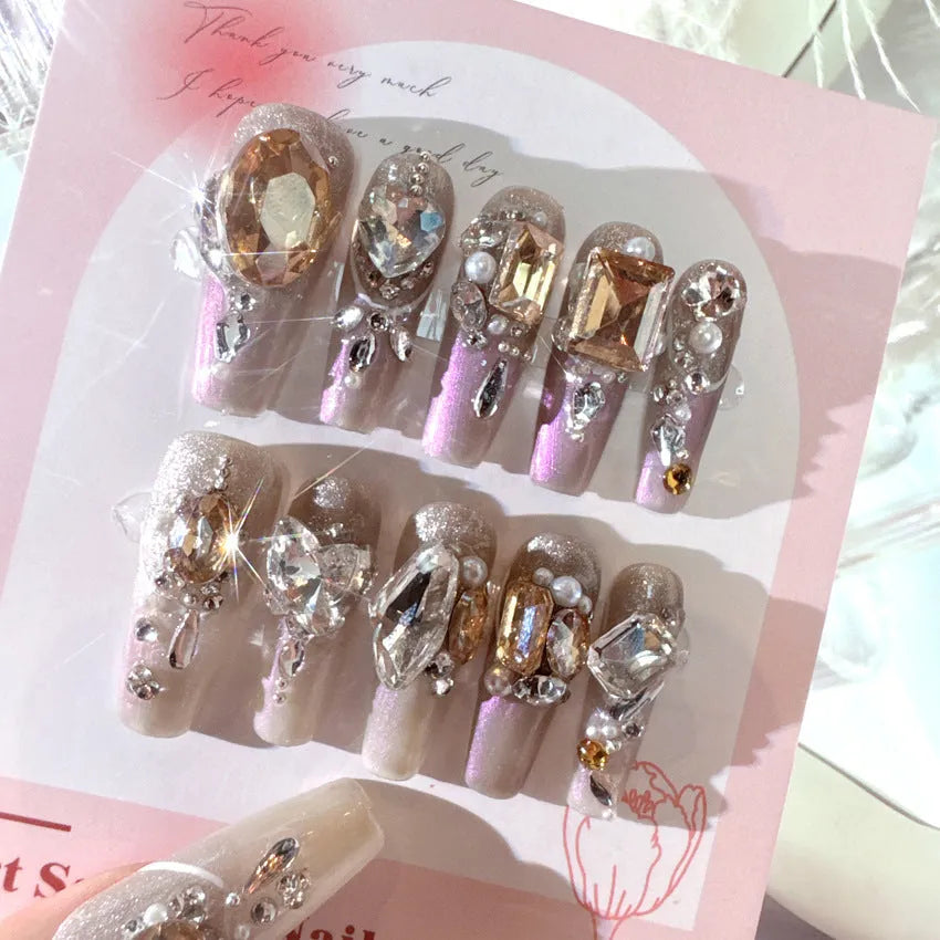 Artificial nail kit with rhinestone designs and phototherapy sealing layer on card packaging