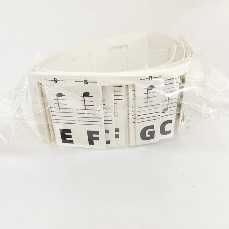 White cardboard piano keyboard stickers for 88 keys showing colour note bars and black notes