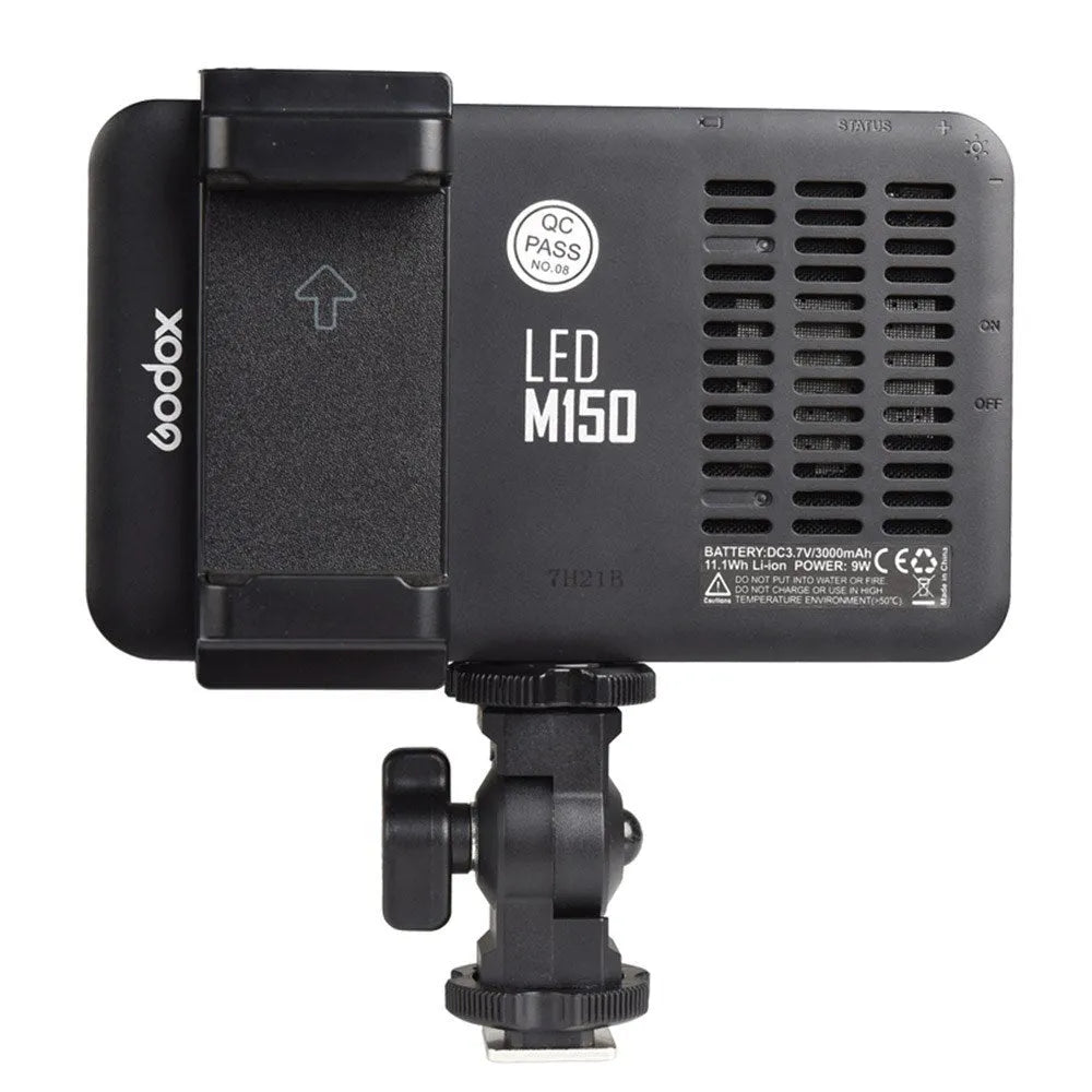 Shenniu M150 ultra-thin LED video light mounted on a mobile phone showing its slim profile.