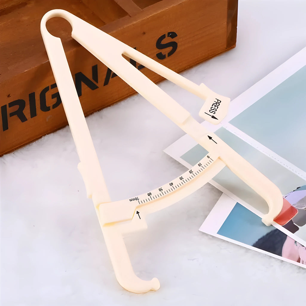 Acrylic body fat caliper with measurement scale showing 0.001mm accuracy