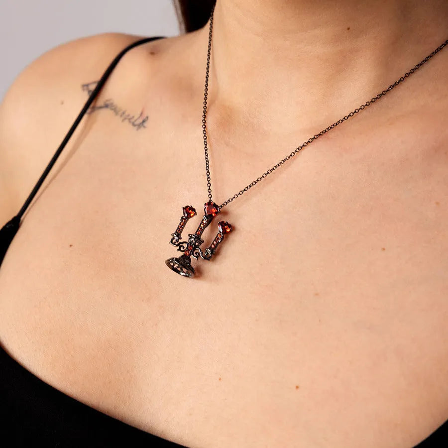 Gothic-style zinc alloy clavicle necklace featuring a hollow candlestick pendant and cross chain in a retro finish.