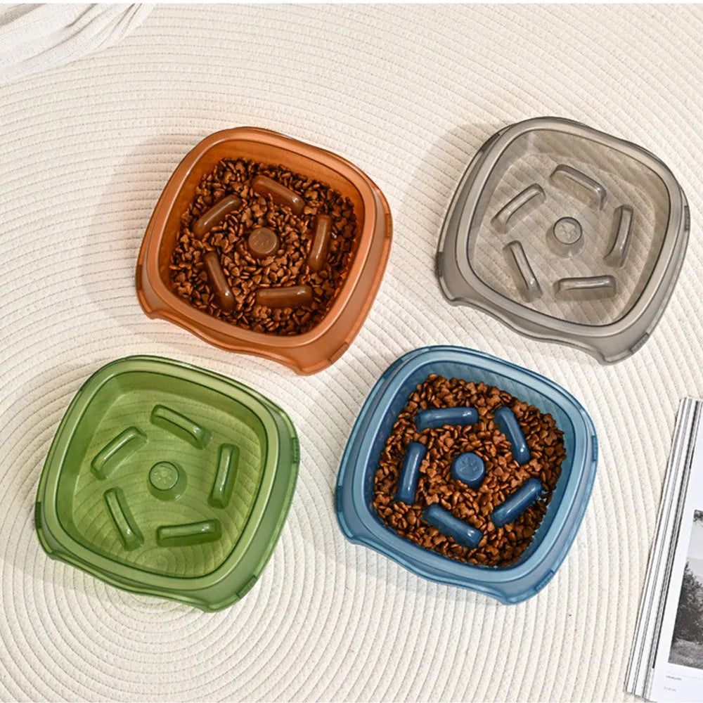 Blue plastic dog slow feeder bowl with anti-choking design on white background