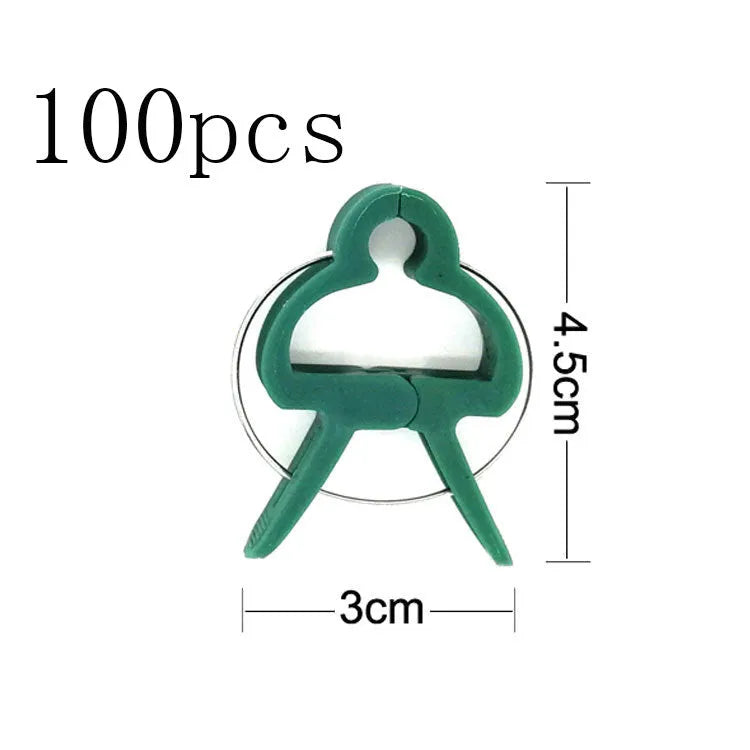 Green plastic and zinc plant fixing clips, large and small sizes, for training climbing vines and tomatoes.