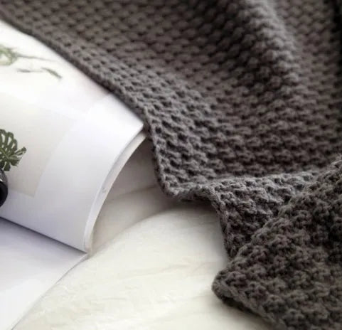 Nordic fringed knit ball blanket in beige colour showing textured design