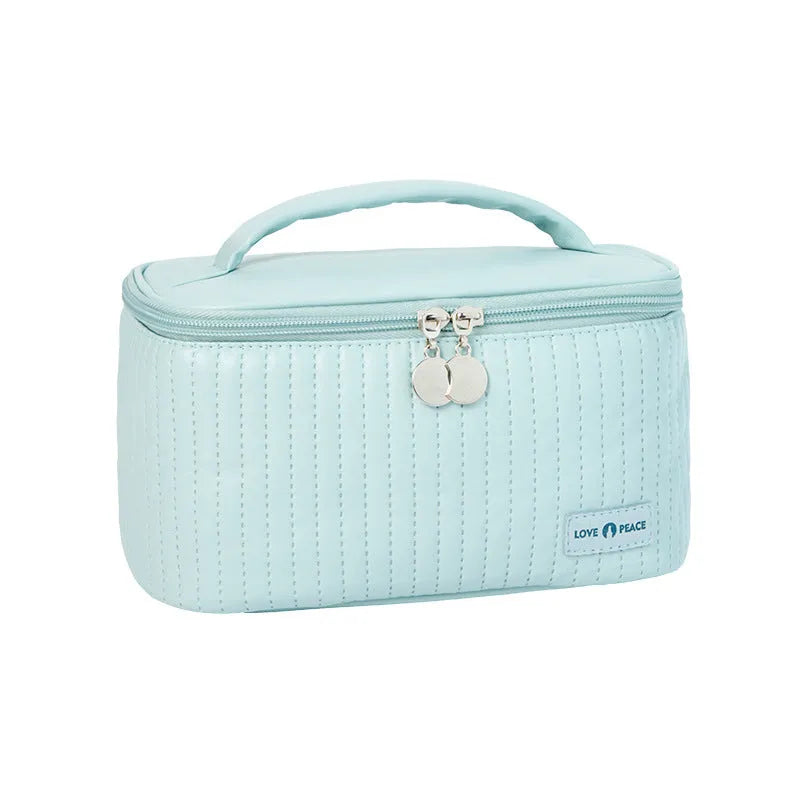 Open-top PU leather makeup bag in a pastel colour from a range of six options.