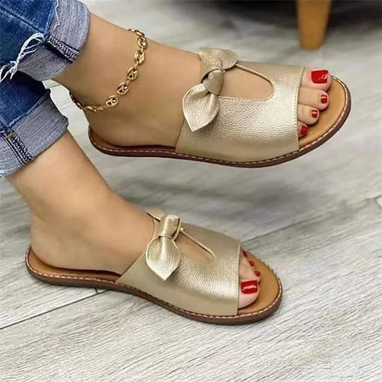 Ladies black fish mouth sandals with a decorative bow on the artificial PU upper.