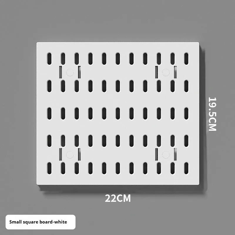 White punch-free plastic wire-wrap board storage rack mounted on a wall with hooks