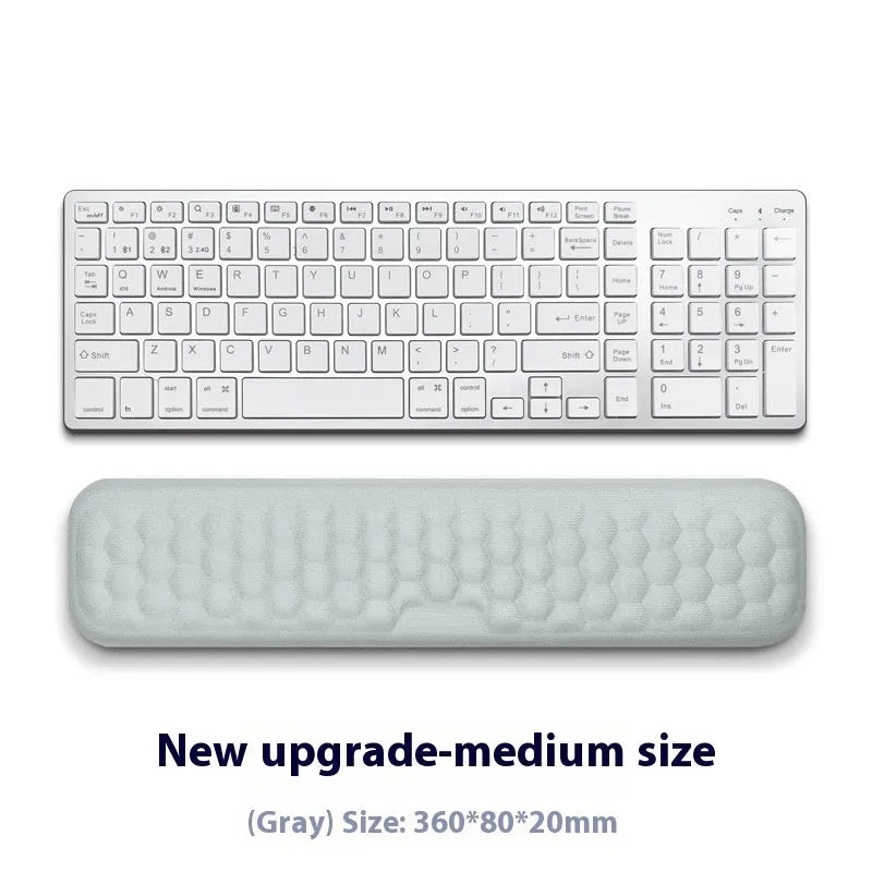 Memory foam mouse wrist rest pad with silicone base in black cloth cover option on desk