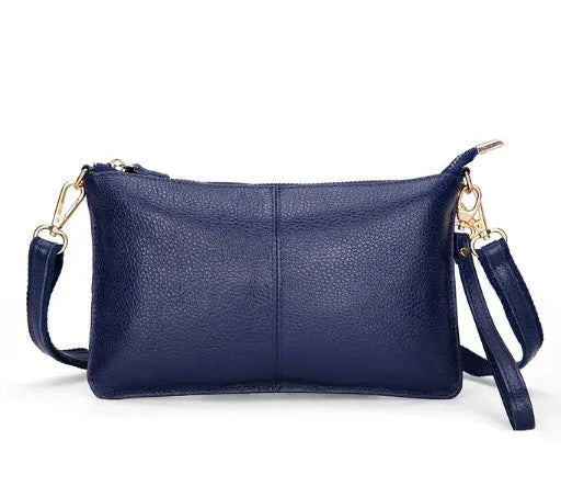 Structured cowhide leather lady slant bag showing front zipper compartment and dual strap options