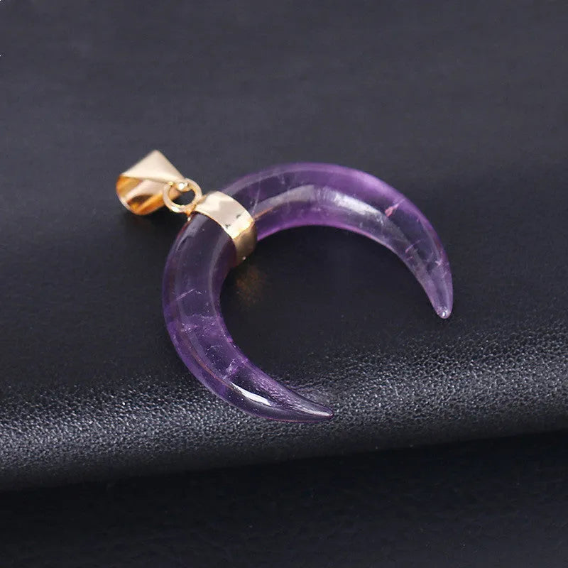 Close-up of a natural stone moon pendant necklace on an electroplated copper chain.