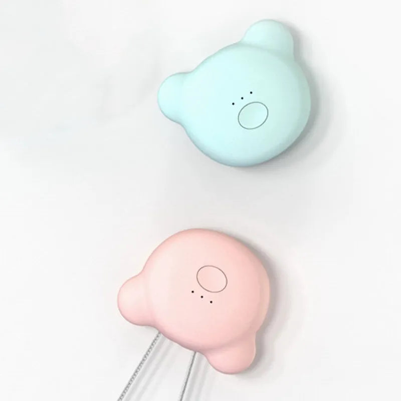 Mini USB portable air purifier necklace in pink, showing compact wearable design.