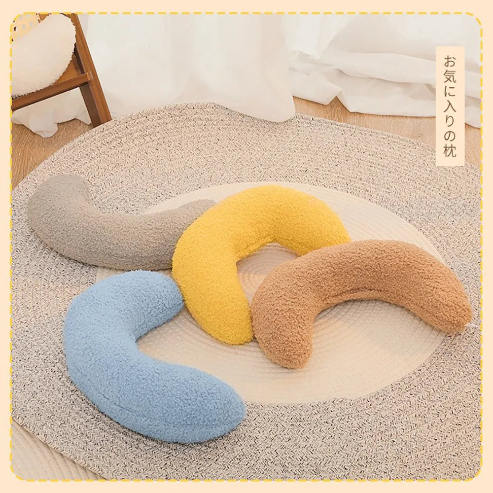 U-shaped blue cat pillow with an adjustable fabric collar for pet neck support.