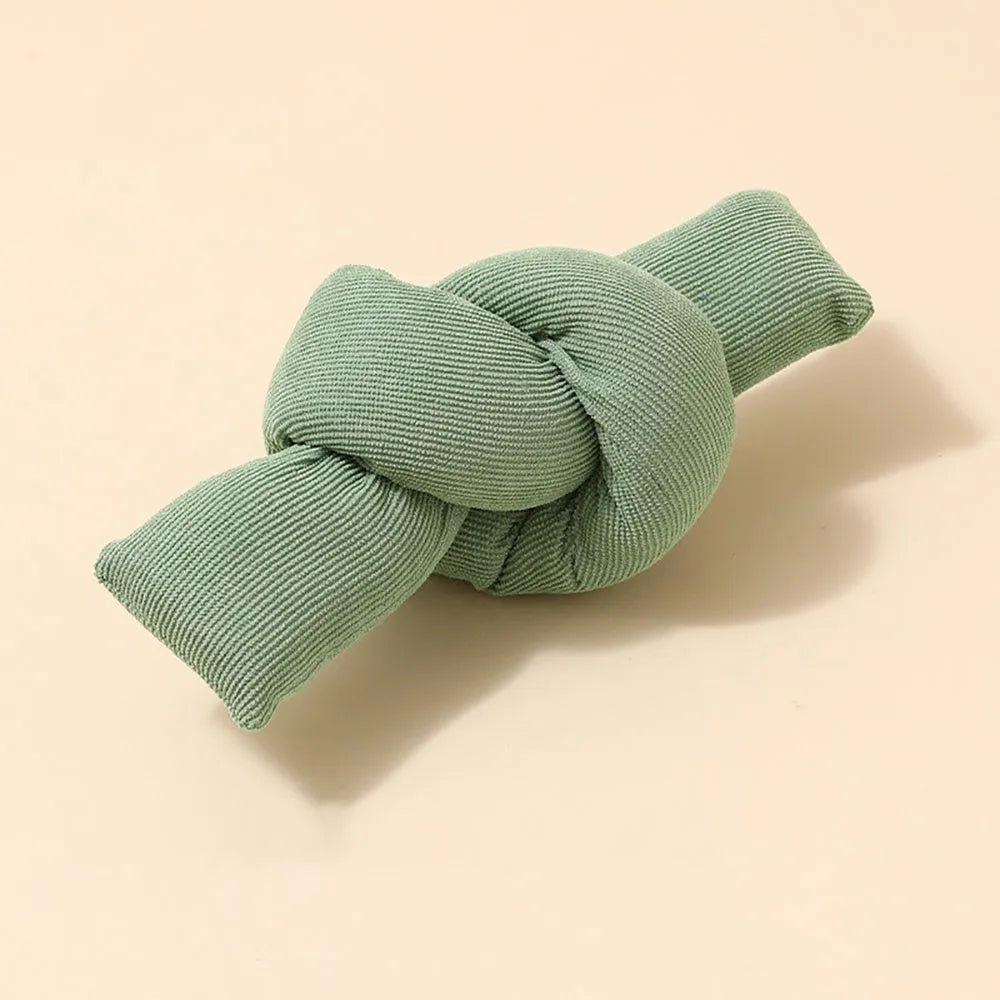 White cotton knotted rope bone dog toy for tug of war and chewing.