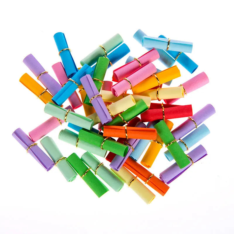 Assortment of colourful mini paper scrolls with metal eyelets in various sizes.