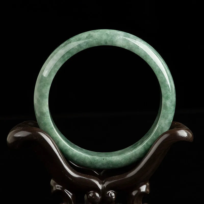 A simple natural emerald green jade bracelet for women, presented with a certificate and gift box.