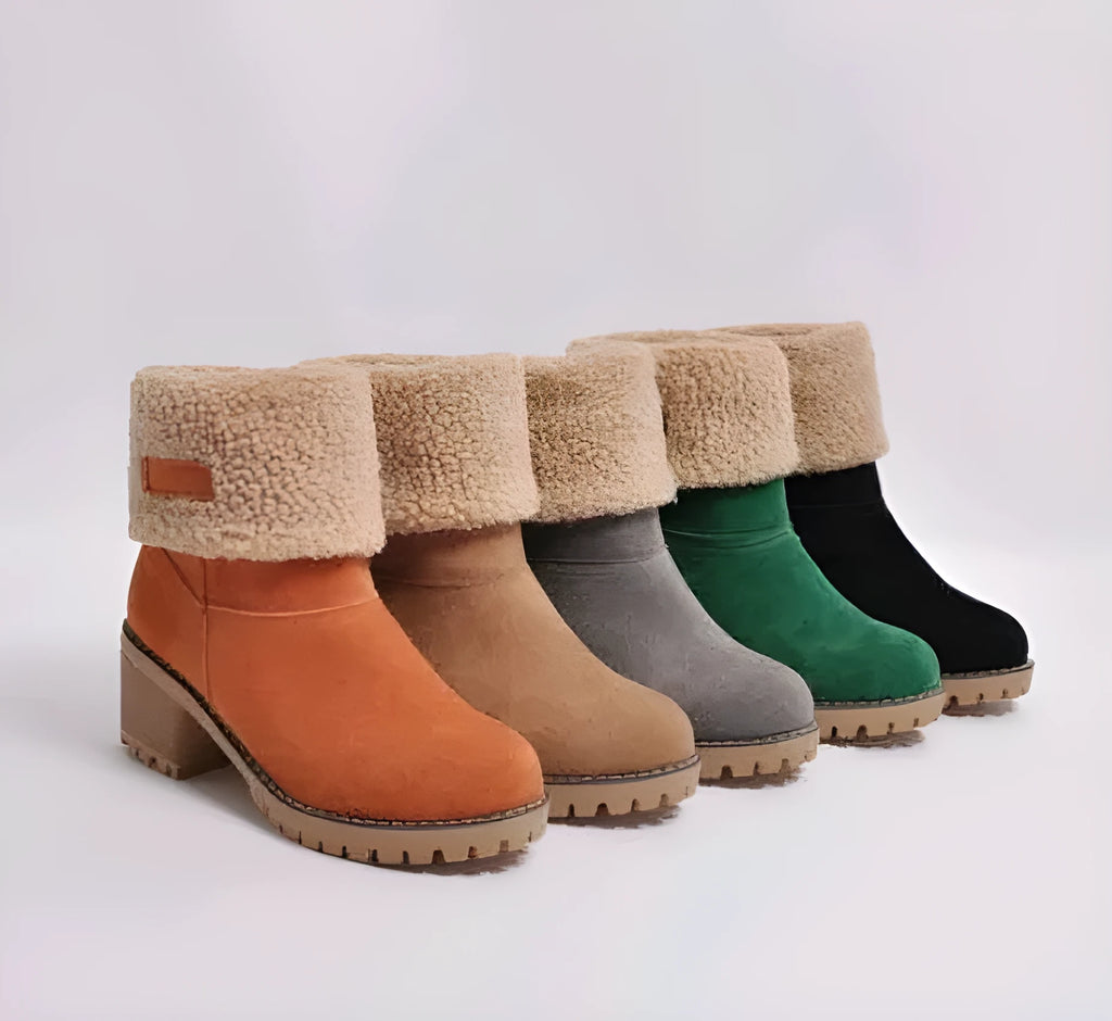 Women's mid-calf suede snow boots with a thick low heel and round toe in grey.