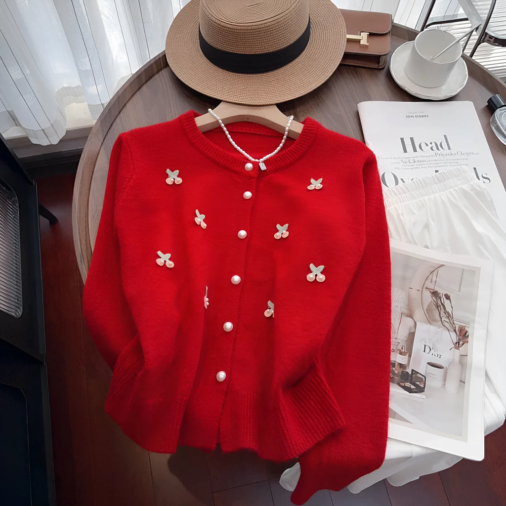 Pink cashmere cardigan coat with bead detailing, shown with a round neck and slim fit.