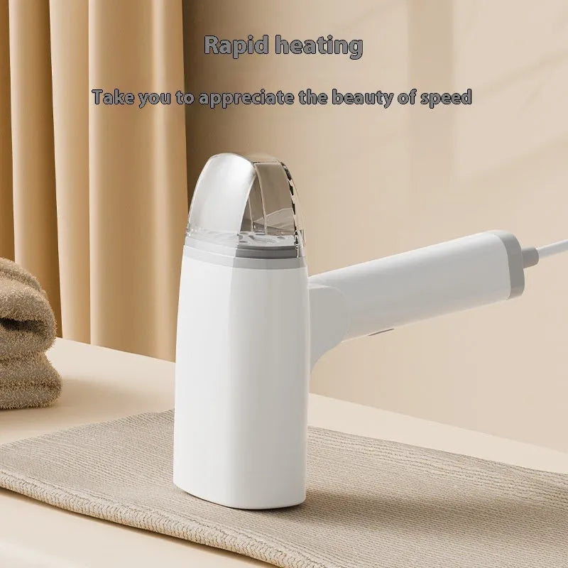 Blue and white handheld garment steamer unit with water tank and nozzle, shown for scale.