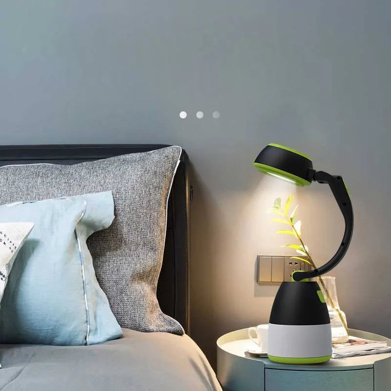 Black/green foldable LED camping lamp showing adjustable head and USB charging port