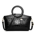 Fabric fashion handbag showing zippered compartments including mobile phone and ID pockets