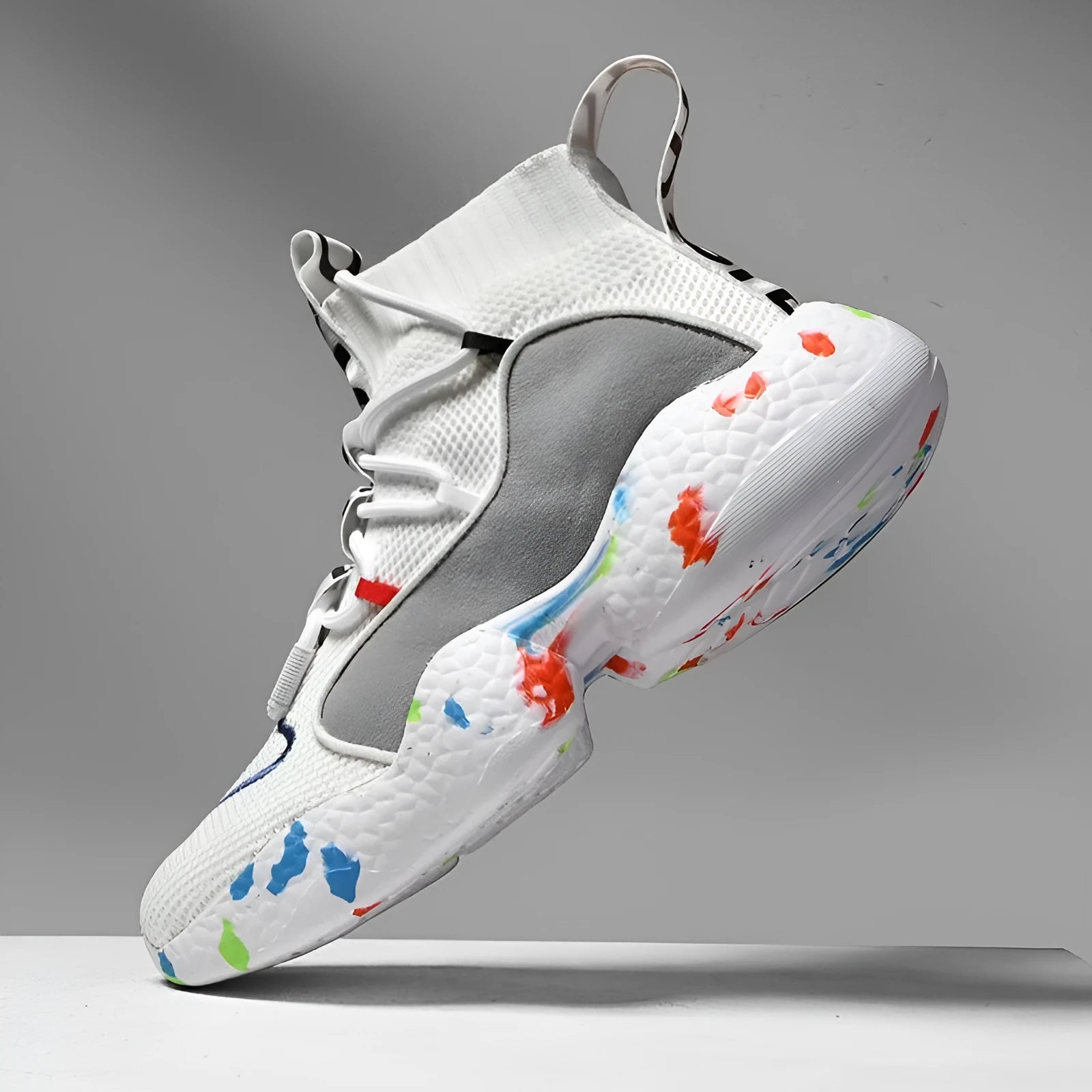 Men's camouflage pattern sneakers with mesh upper and vulcanised rubber sole on a white background.