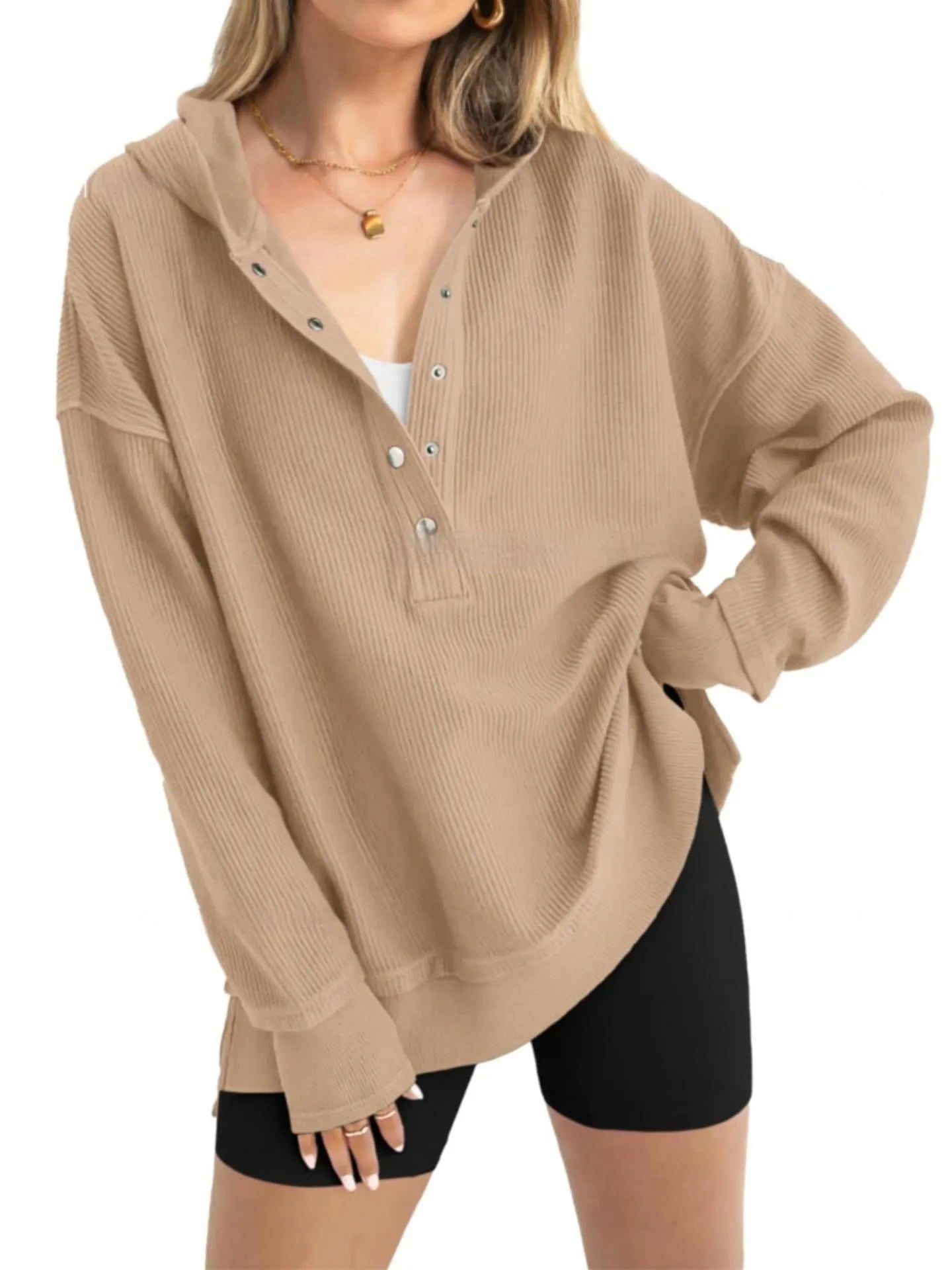 Women's loose peacock green raglan sleeve pullover sweater on a hanger.