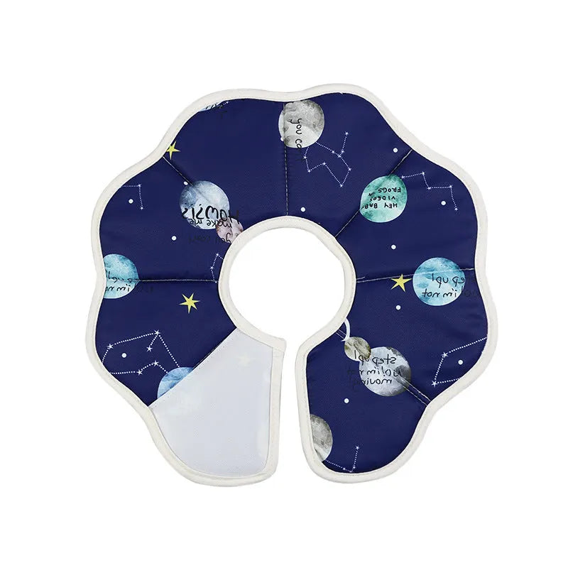 Soft adjustable cat recovery cone collar in constellation pattern on a small cat