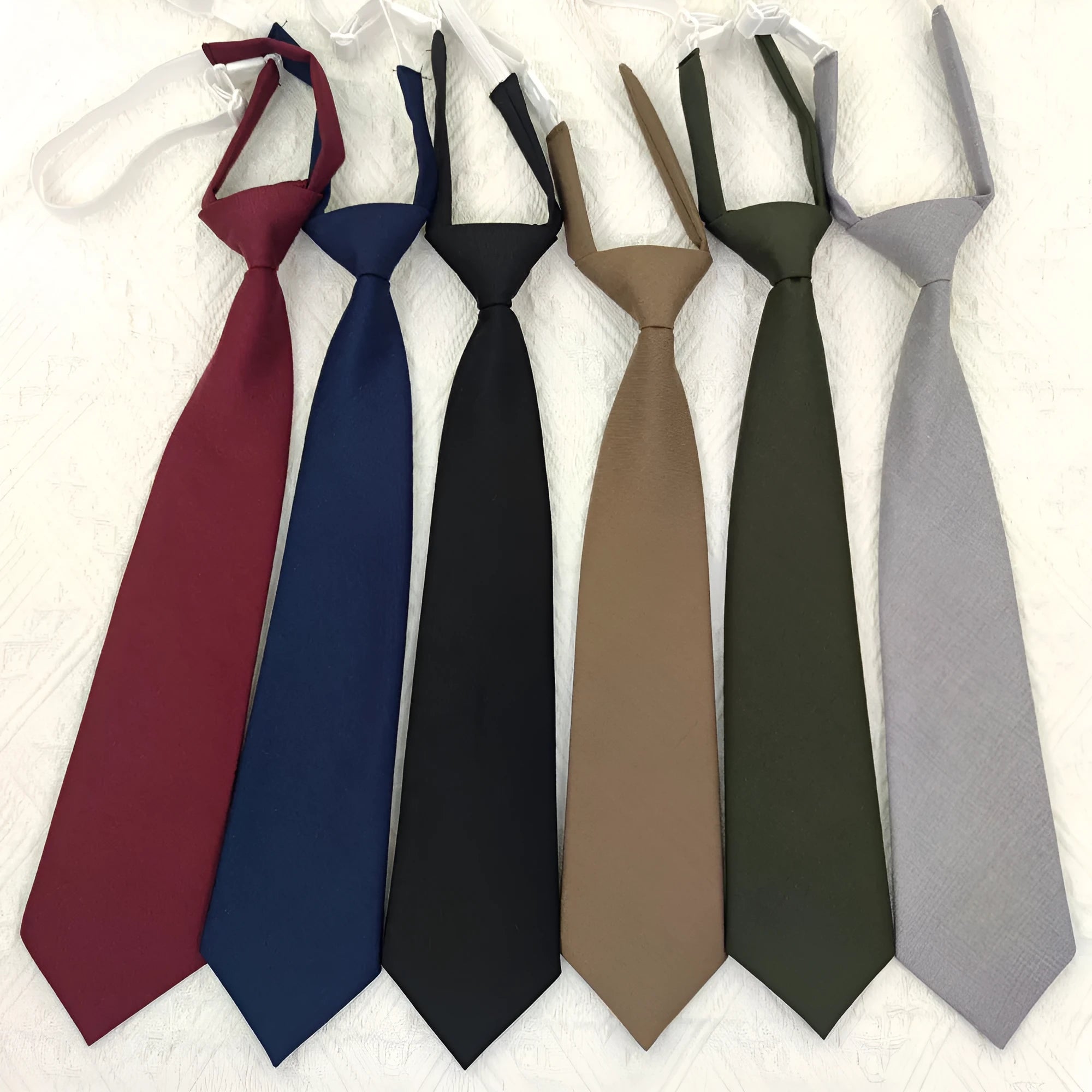 Solid colour cotton bow tie for men in arrow-type style on a white background.