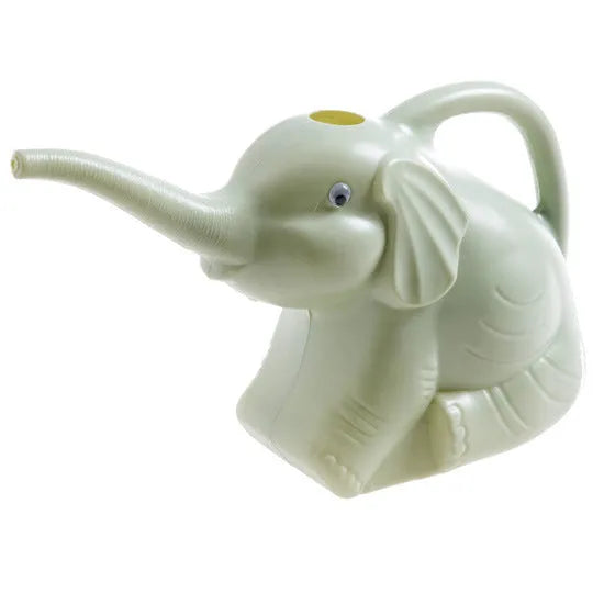 Pink baby elephant-shaped watering can with a long nozzle and bottle-shaped handle on a table.