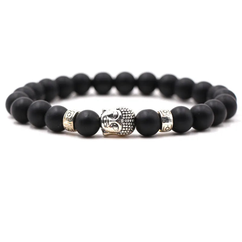 Tigereye stone Buddha head stretch bracelet with 8mm beads on a wrist.