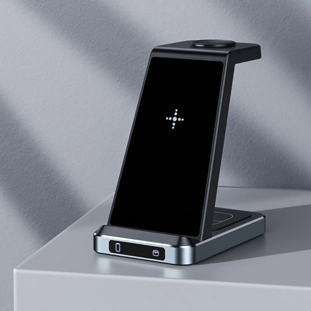 Three-in-one wireless charger in black with phone, watch, and earbuds placed on charging zones