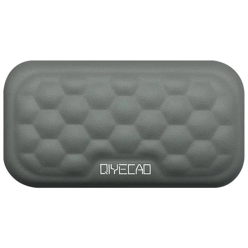Memory foam mouse wrist rest pad with silicone base in black cloth cover option on desk
