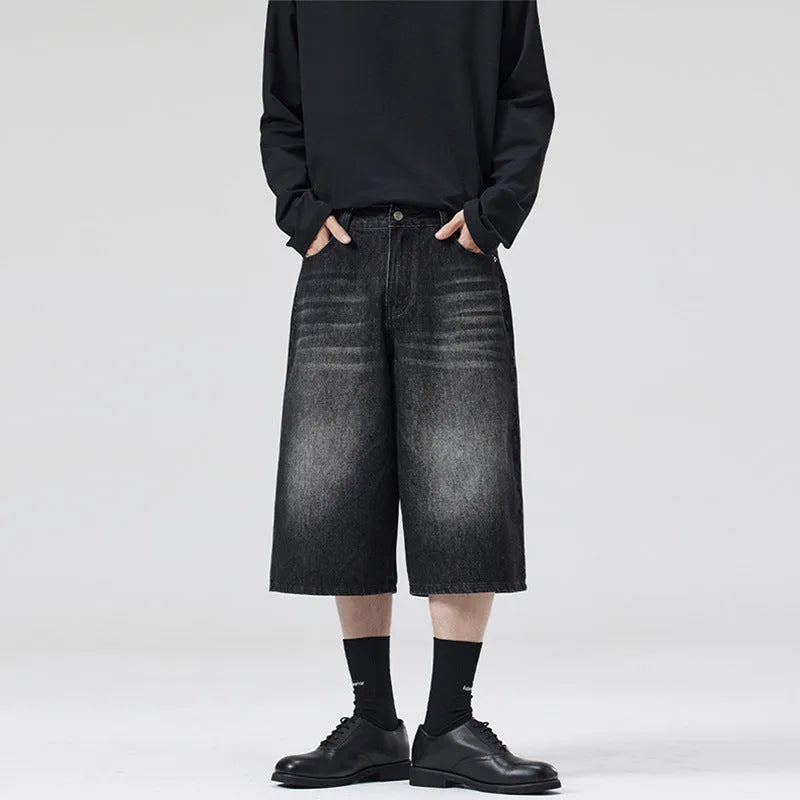 Men's loose straight-leg denim shorts in light blue on a model for summer