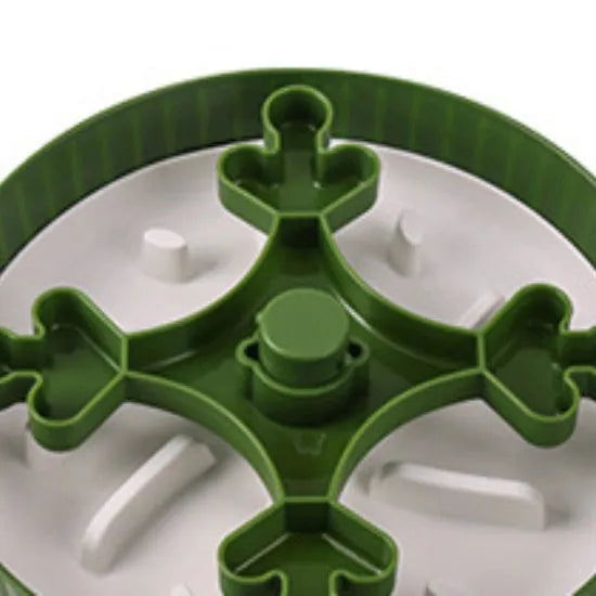 Grey plastic pet bowl with rotating windmill-pattern slow feeder licking mat inside